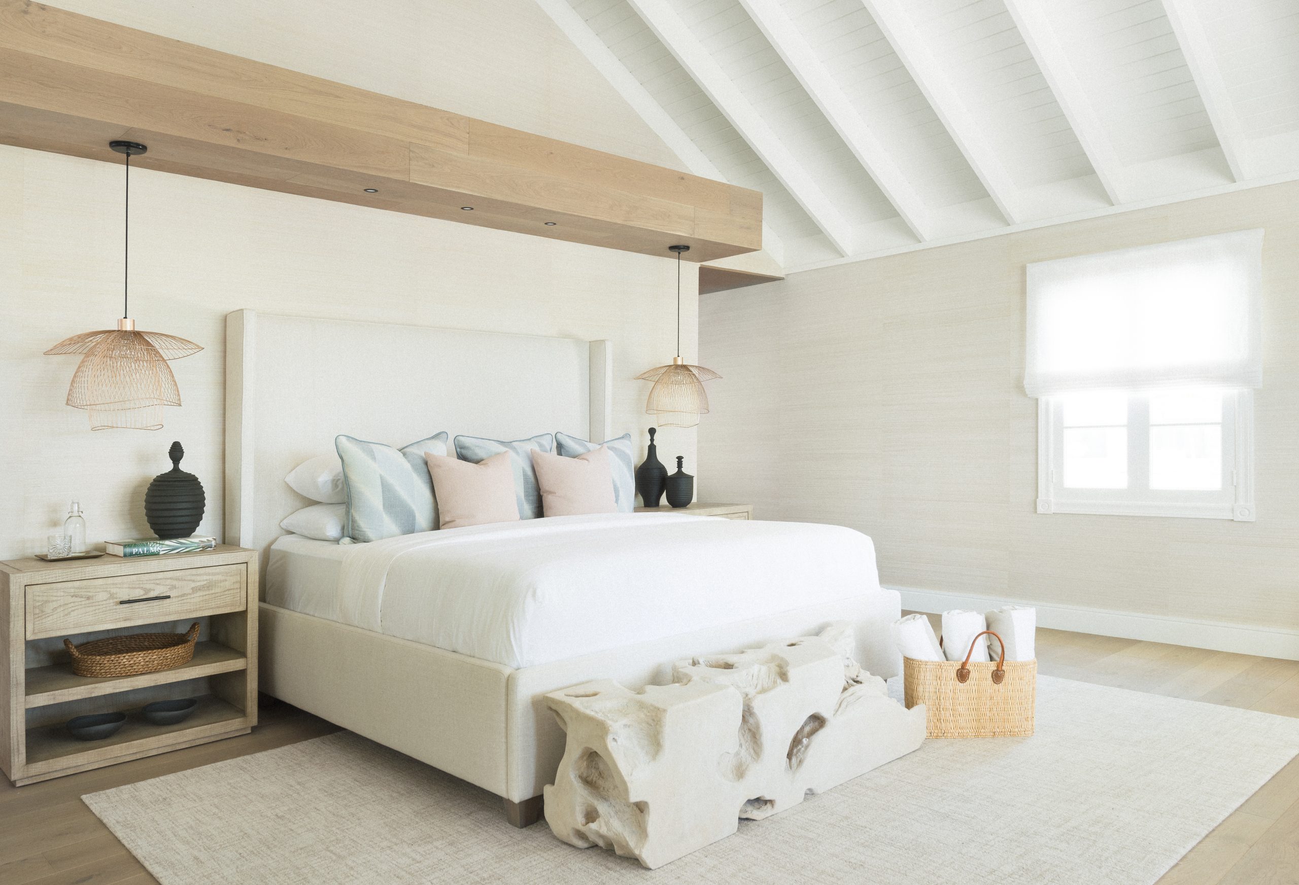 Bright, elegant bedroom at Caerula Mar Club, South Andros Island, with vaulted ceiling, pastel decor, and luxury resort furnishings.