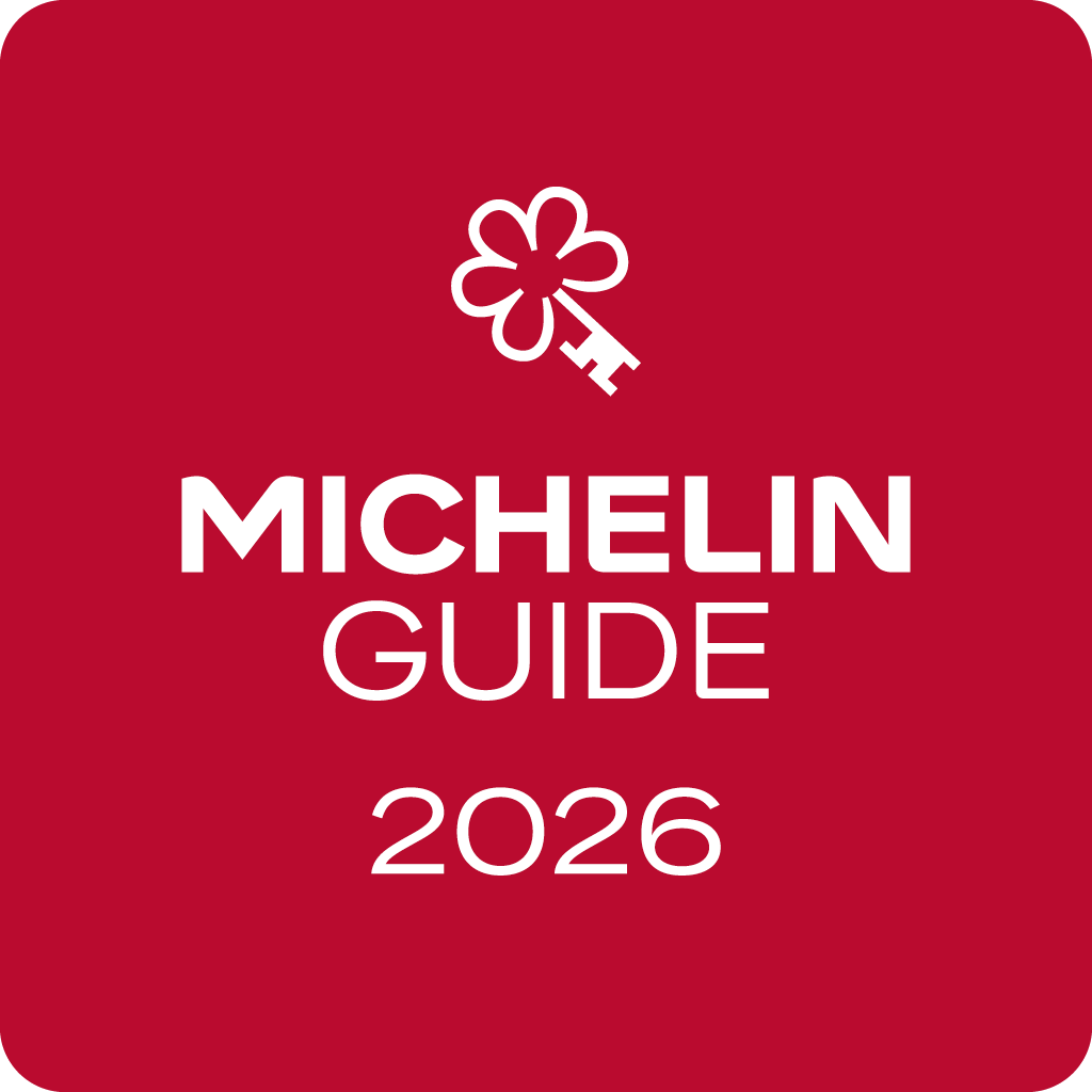 Red square featuring a white Michelin star and key symbol above bold white text reading “MICHELIN GUIDE 2026,” representing the prestigious Michelin restaurant guide, as seen at Caerula Mar Club, a luxury boutique resort on South Andros Island in The Bahamas.